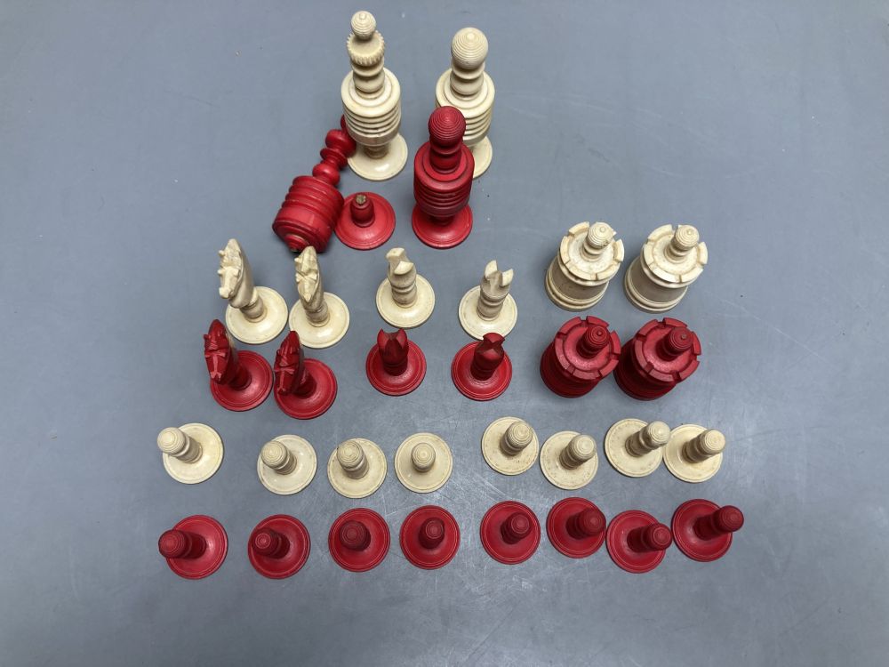 A late 19th century stained natural bone chess set